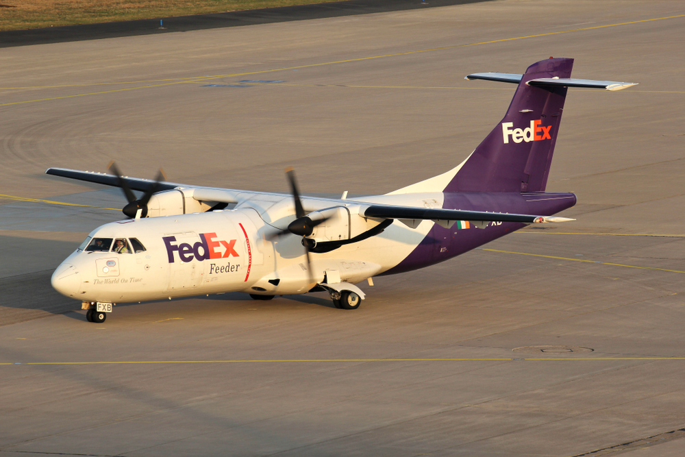 A FedEx ATR42-500 freighter aircraft on the ground at an airport