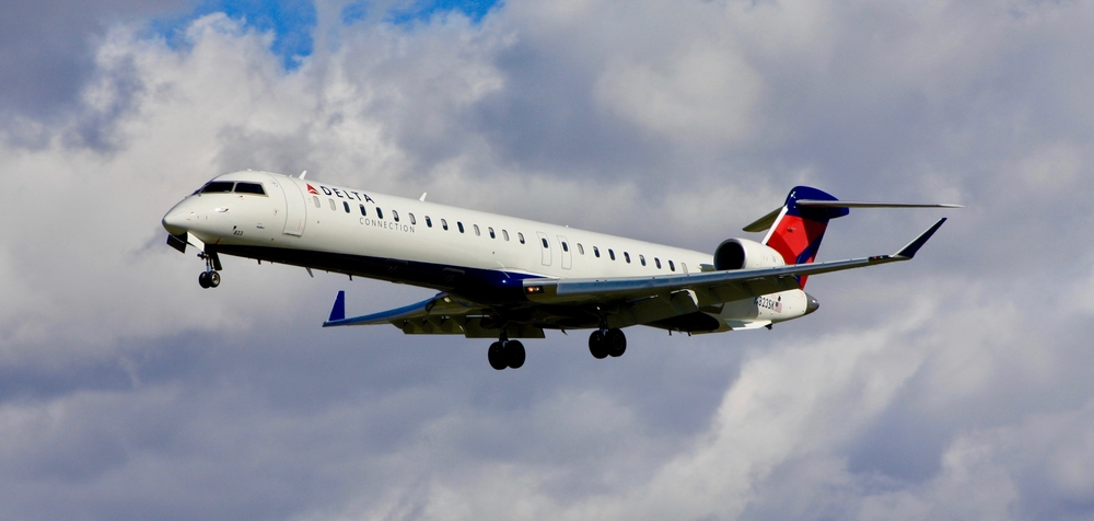 A Delta Airlines Bombardier CRJ-900 aircraft landing in flight