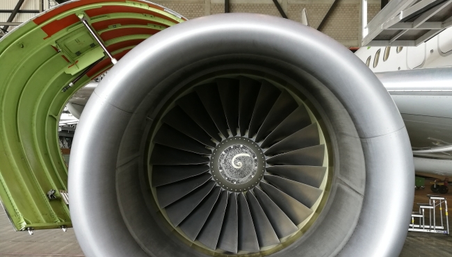 A close up view of a jet engine mounted on a Boeing 737