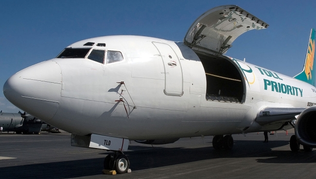 A Boeing 737 jet cargo aircraft with it's cargo door open