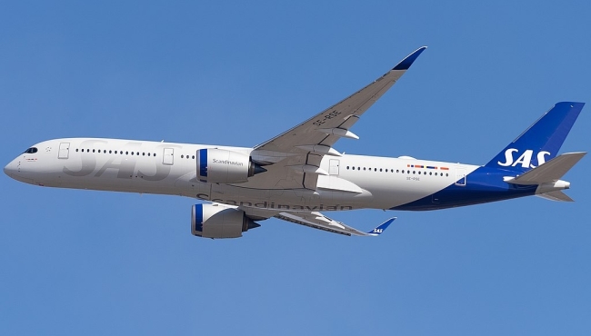 An SAS Airbus A350 in flight in blue cloudless skies