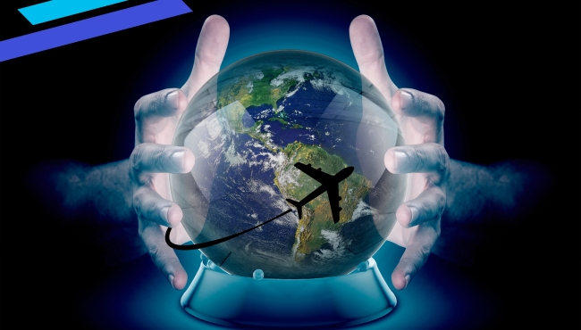 A pair of hands cradle a globe with an aircraft in flight