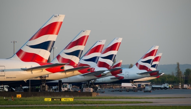A row of British Airways long haul jet airliner aircraft on the ground at Heathrow Airport in London