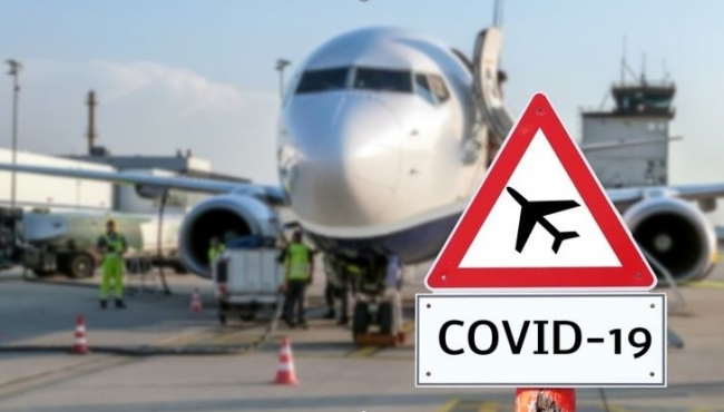 image of a covid-19 sign with an aeroplane in the background