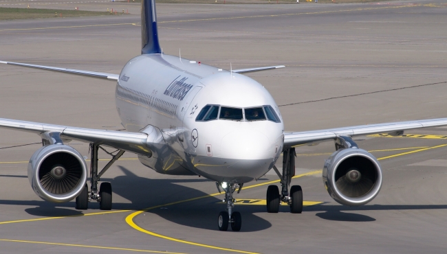 A Lufthansa Airbus A320 jet aircraft on the ground at an airport