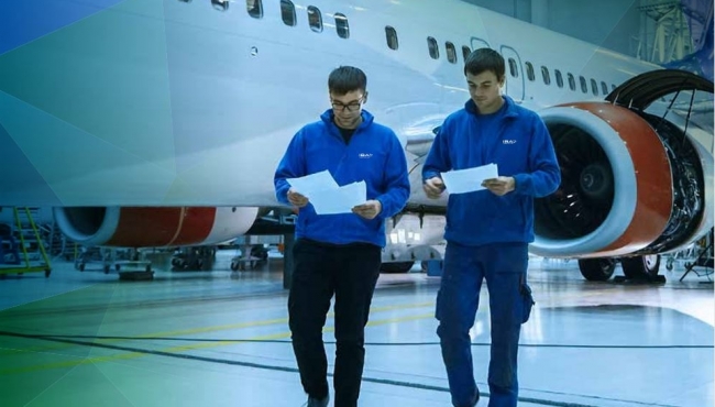 image of 2 men with paperwork walking away from an aeroplane